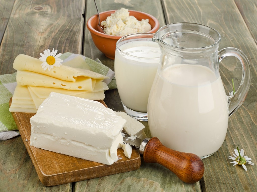 Fresh milk and dairy products on a wooden table. Selective focus